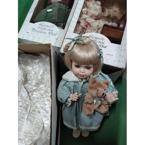 175 - A quantity of 4 boxed dolls, the Leonardo collection, including one on a chair, one on rocking horse... 