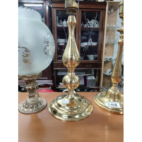 198 - A collection of 4 brass lamps, one with a glass etched shade.
Tallest one has height of 38cm.