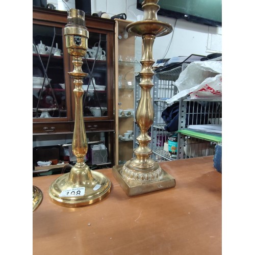 198 - A collection of 4 brass lamps, one with a glass etched shade.
Tallest one has height of 38cm.