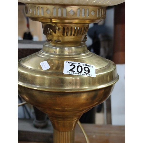 209 - A brass oil lamp complete with shade and chimney converted to electric shade in excellent condition ... 