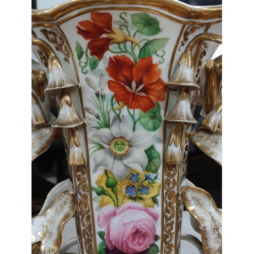 215 - A large impressive old Paris porcelain vase with hand painted floral scenes to the front, with ornat... 