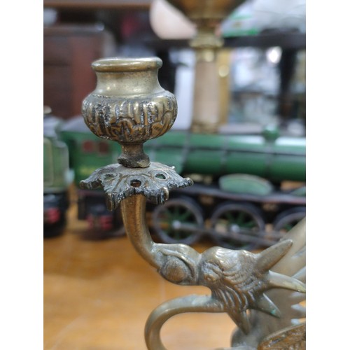 219 - A pair of bronze dragon formed candlesticks, very well detailed in excellent condition.
Height 20cm,... 