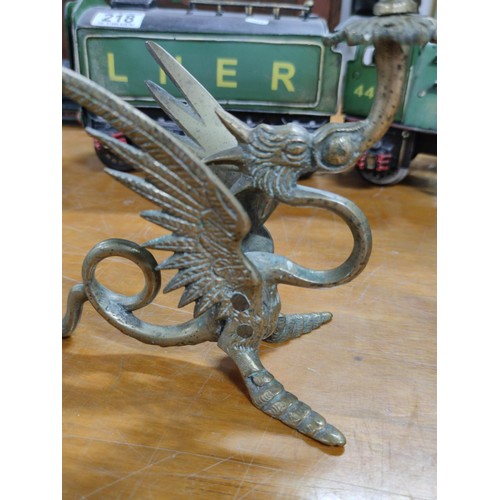 219 - A pair of bronze dragon formed candlesticks, very well detailed in excellent condition.
Height 20cm,... 