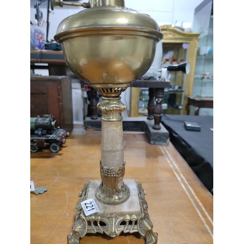 221 - A marble and brass formed art nouveau oil lamp. Missing shade.
Height 50cm, 15cm square base.