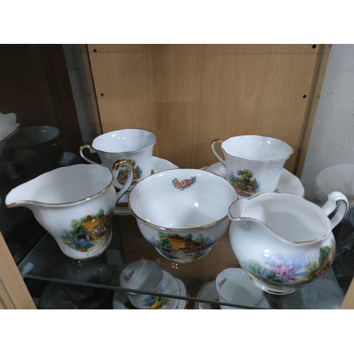 469 - A quantity of glassware and china including a 20 piece Royal Vale part tea set, a quantity of cut gl... 