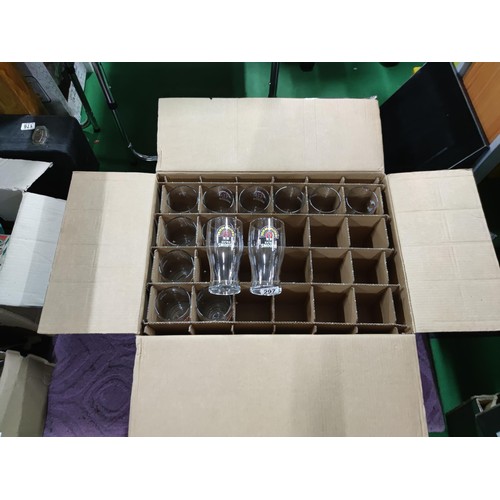 297 - A box containing 37 John Smiths Extra Smooth pint glasses in a segmented box.