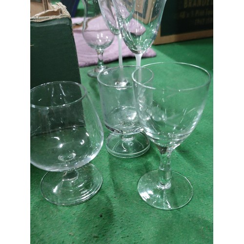 298 - A very large quantity of table glassware including champagne flutes, brandy glasses, sherry glasses,... 