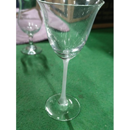 298 - A very large quantity of table glassware including champagne flutes, brandy glasses, sherry glasses,... 