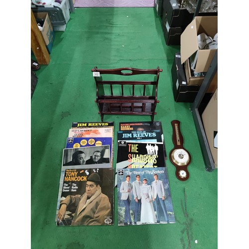 302 - A quantity of 10 LP's including Jim Reeves, Tony Hancock, The Seekers etc. Along with a small barome... 