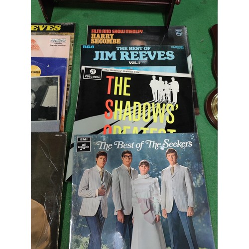 302 - A quantity of 10 LP's including Jim Reeves, Tony Hancock, The Seekers etc. Along with a small barome... 