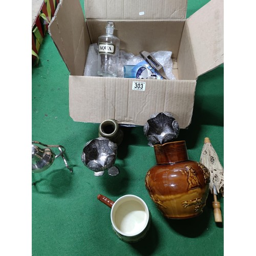303 - A box containing an assortment of collectables including a John Peel tankard, a vintage aqua bottle,... 