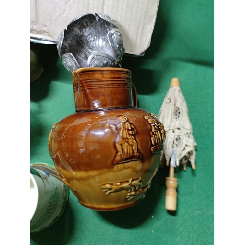 303 - A box containing an assortment of collectables including a John Peel tankard, a vintage aqua bottle,... 