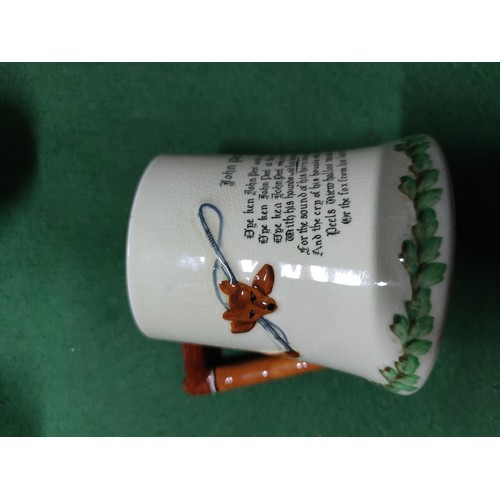 303 - A box containing an assortment of collectables including a John Peel tankard, a vintage aqua bottle,... 