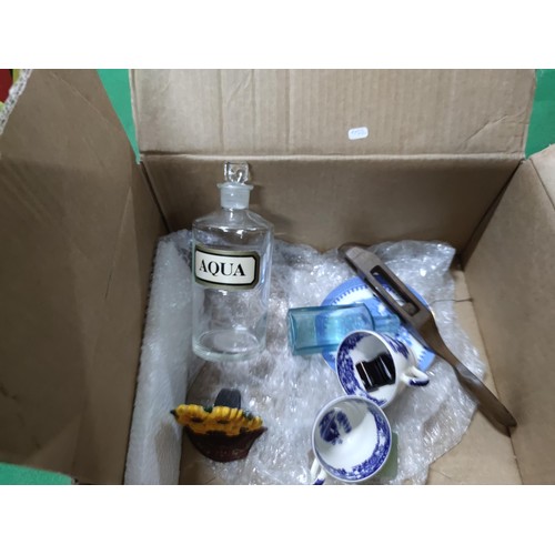 303 - A box containing an assortment of collectables including a John Peel tankard, a vintage aqua bottle,... 