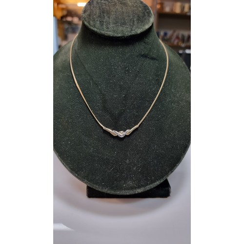 423 - Hallmarked 9ct yellow gold necklace with a two tone yellow and white gold pendant inset with three s... 