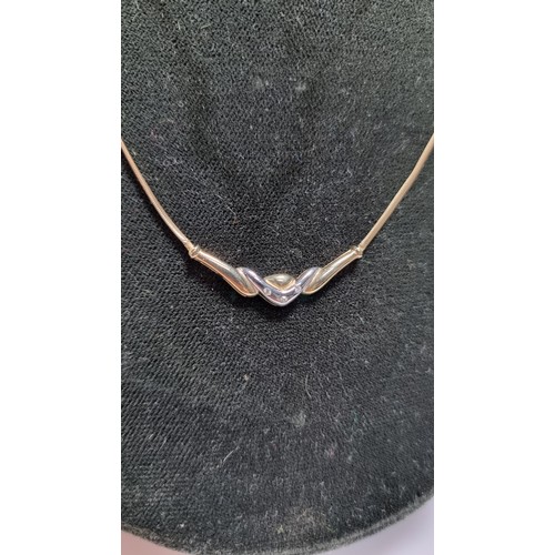 423 - Hallmarked 9ct yellow gold necklace with a two tone yellow and white gold pendant inset with three s... 