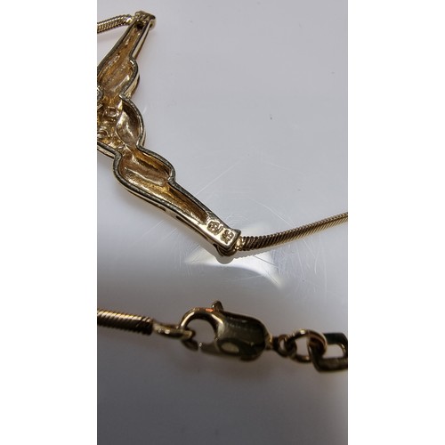 423 - Hallmarked 9ct yellow gold necklace with a two tone yellow and white gold pendant inset with three s... 