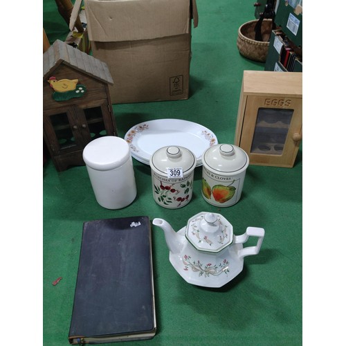 309 - A box containing a quantity of collectables including 2 wooden egg storage boxes, 5 arcopal platters... 