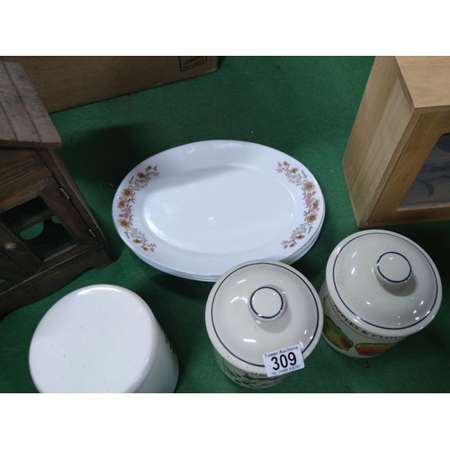309 - A box containing a quantity of collectables including 2 wooden egg storage boxes, 5 arcopal platters... 