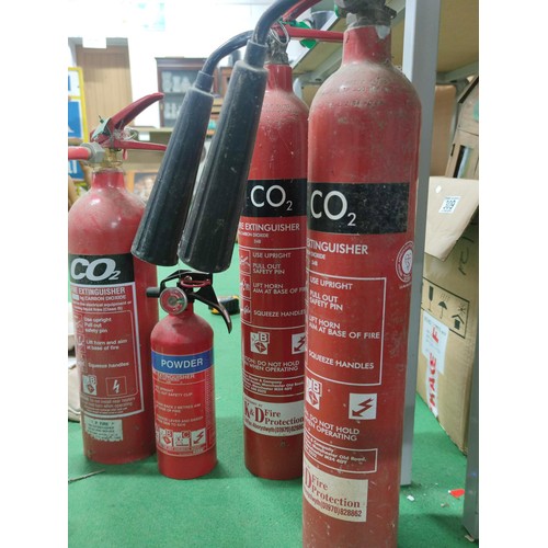 310 - A collection of 4 vintage fire extinguishers, 3 for CO2
and a small powder one, all empty.
Tallest o... 