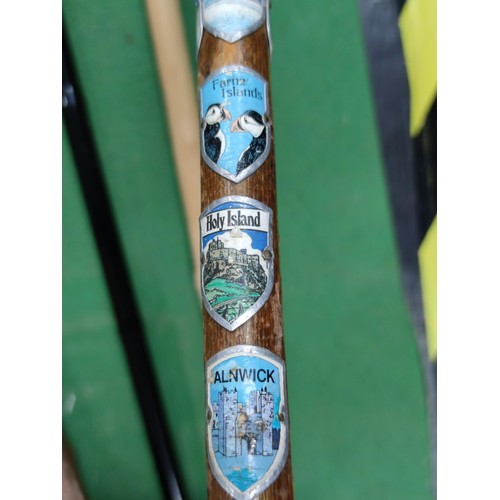 315 - A collection of 4 walking sticks including a collapsible mobility aid stick, one contains a large qu... 