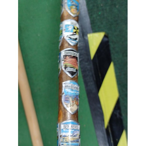315 - A collection of 4 walking sticks including a collapsible mobility aid stick, one contains a large qu... 