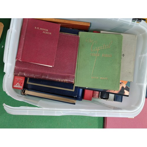 316 - A plastic box containing a good quantity of empty vintage and modern stamp albums etc, including Sta... 