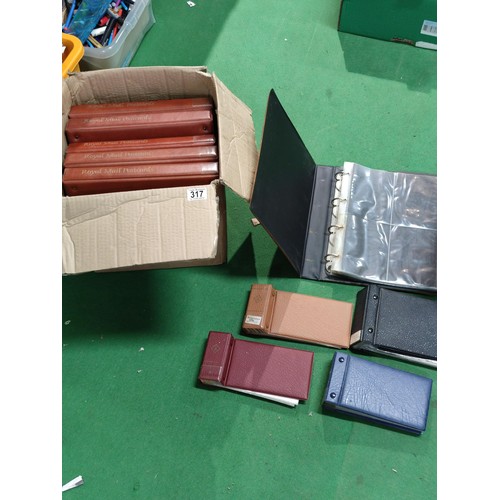 317 - A box containing a quantity of Royal Mail and other postcard/PHQ albums. Empty!