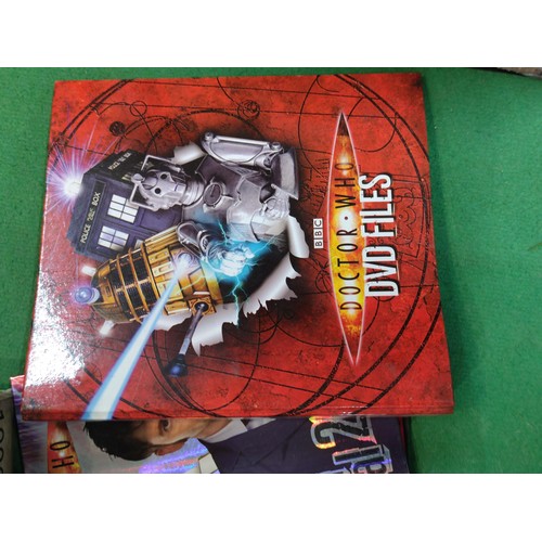 321 - A box containing a large quantity of Dr Who memorabilia. Including storybooks, annuals, sealed magaz... 