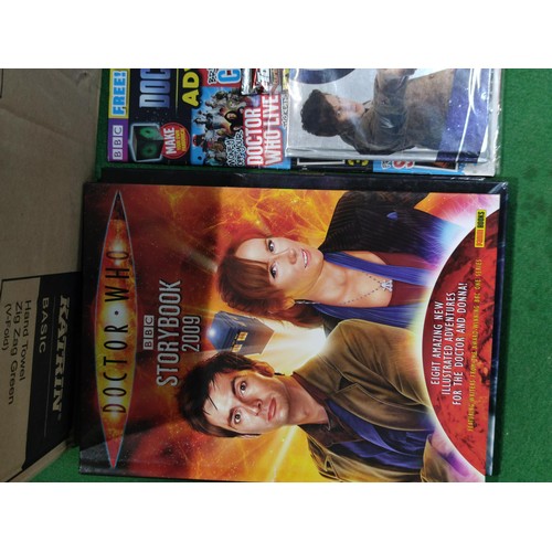 321 - A box containing a large quantity of Dr Who memorabilia. Including storybooks, annuals, sealed magaz... 