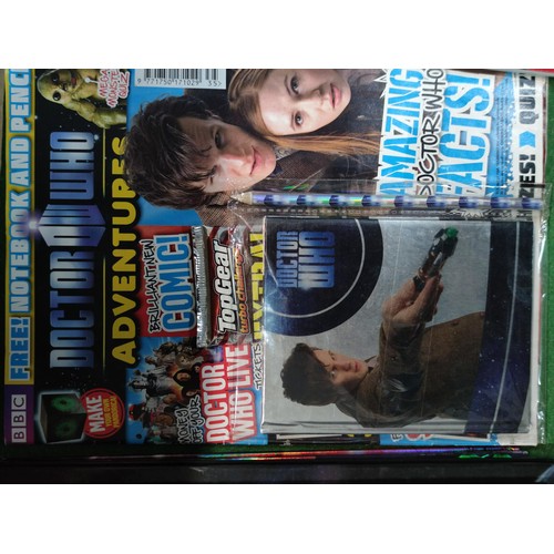 321 - A box containing a large quantity of Dr Who memorabilia. Including storybooks, annuals, sealed magaz... 