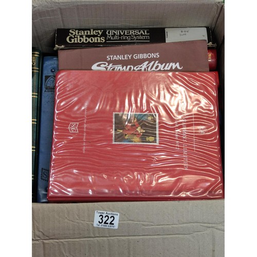 322 - A cardboard box containing a god quantity of empty vintage and modern stamp albums etc, including St... 