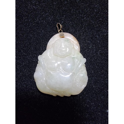 406 - A well carved solid jade Buddha pendant with a 9ct gold bale, in excellent condition, tested as jade... 