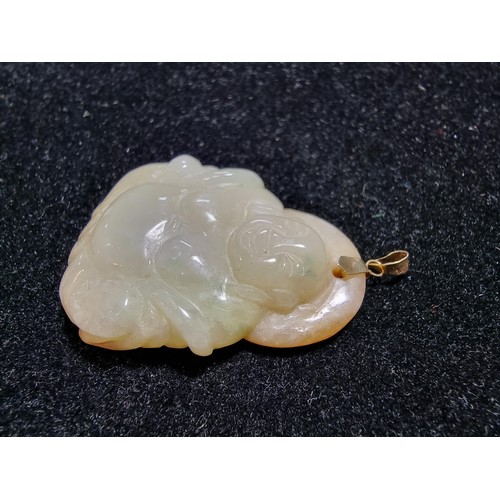406 - A well carved solid jade Buddha pendant with a 9ct gold bale, in excellent condition, tested as jade... 