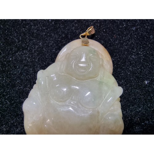406 - A well carved solid jade Buddha pendant with a 9ct gold bale, in excellent condition, tested as jade... 