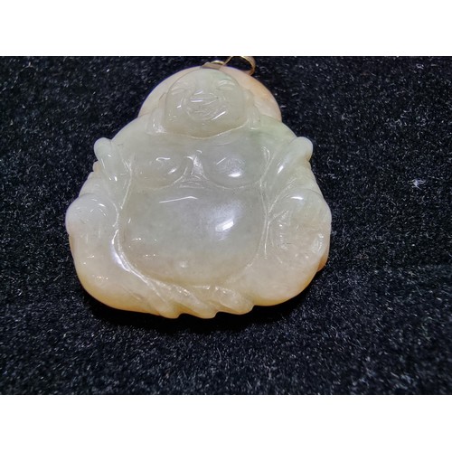 406 - A well carved solid jade Buddha pendant with a 9ct gold bale, in excellent condition, tested as jade... 