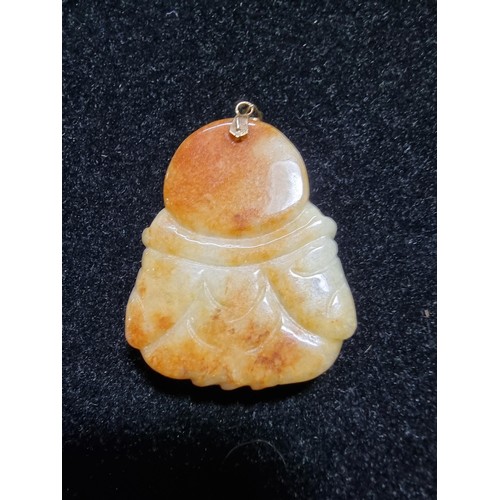 406 - A well carved solid jade Buddha pendant with a 9ct gold bale, in excellent condition, tested as jade... 