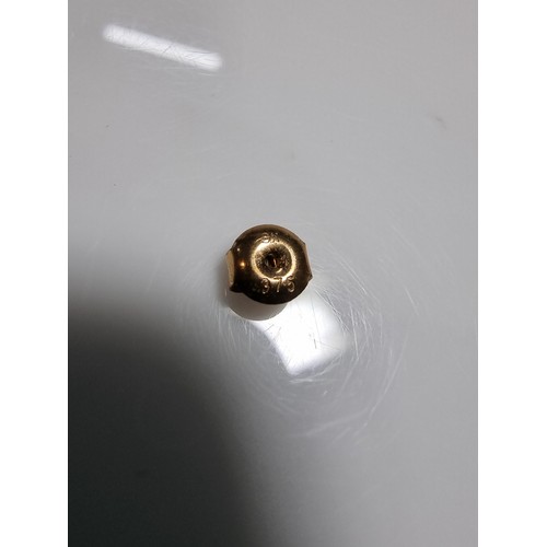 413 - A pair of 9ct yellow gold large genuine pearl stud earrings complete with butterfly backs in good co... 