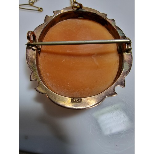 416 - An ornate 9ct yellow gold carved shell cameo brooch with a portrait of a lady looking right.
In exce... 