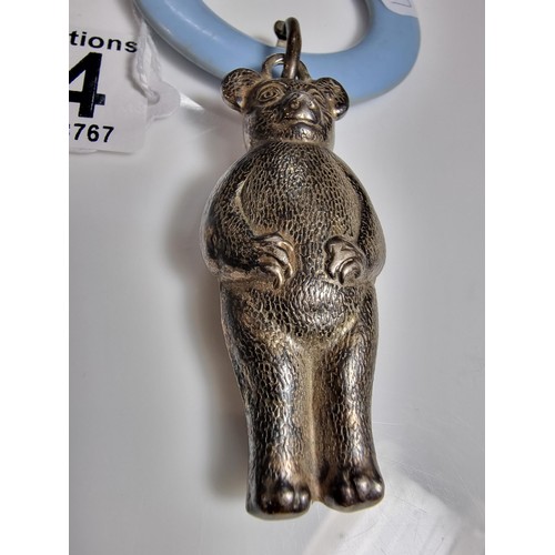 424 - A tested as sterling silver antique babies teething ring with a sterling silver teddy rattle in very... 