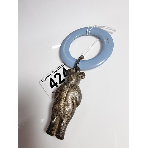 424 - A tested as sterling silver antique babies teething ring with a sterling silver teddy rattle in very... 