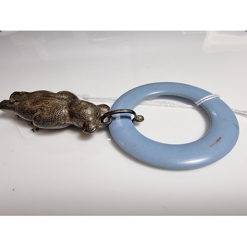 424 - A tested as sterling silver antique babies teething ring with a sterling silver teddy rattle in very... 
