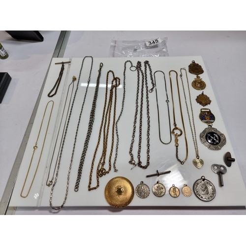 345 - A suite of various pocket watch / Albert chains along with a quantity of various pocket watch fobs, ... 