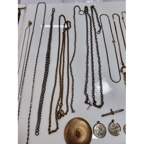 345 - A suite of various pocket watch / Albert chains along with a quantity of various pocket watch fobs, ... 