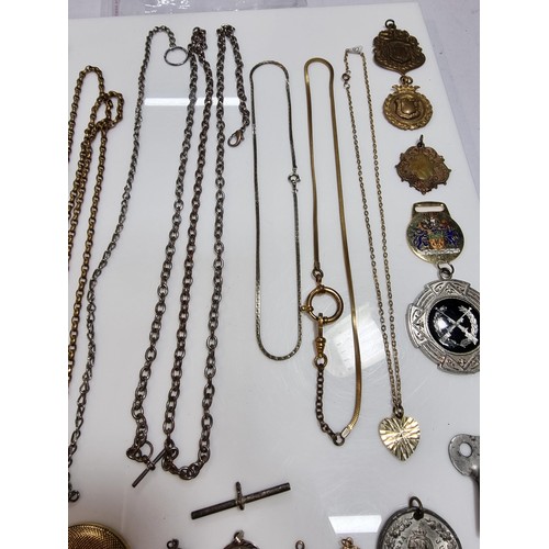 345 - A suite of various pocket watch / Albert chains along with a quantity of various pocket watch fobs, ... 