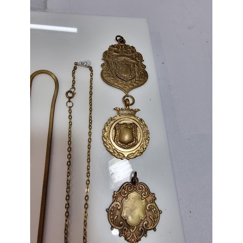 345 - A suite of various pocket watch / Albert chains along with a quantity of various pocket watch fobs, ... 