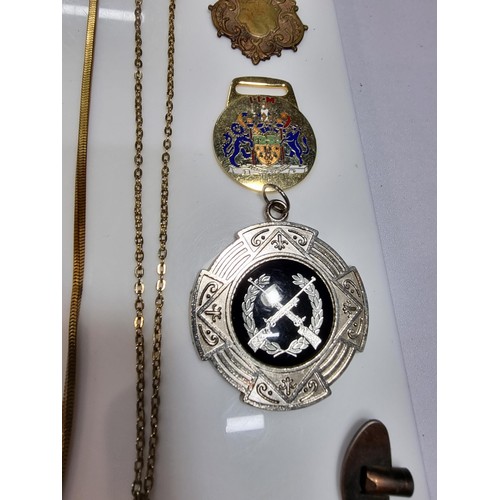 345 - A suite of various pocket watch / Albert chains along with a quantity of various pocket watch fobs, ... 