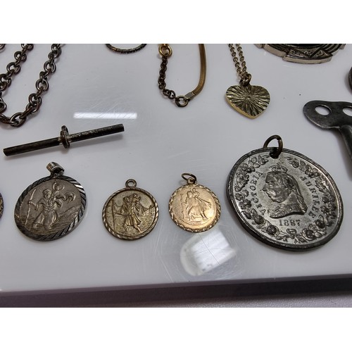 345 - A suite of various pocket watch / Albert chains along with a quantity of various pocket watch fobs, ... 
