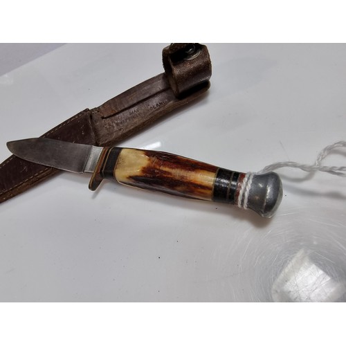 346 - 2 collectable knives including a vintage small antler handled knife with an aluminium pommel, made i... 