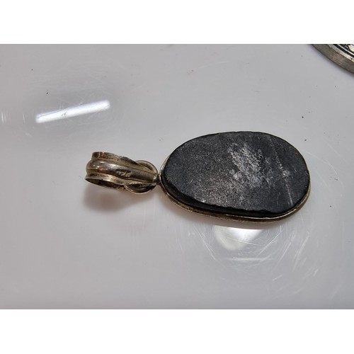 347 - A quantity of collectable jewellery including an unusually pewter pendant most likely Danish, along ... 